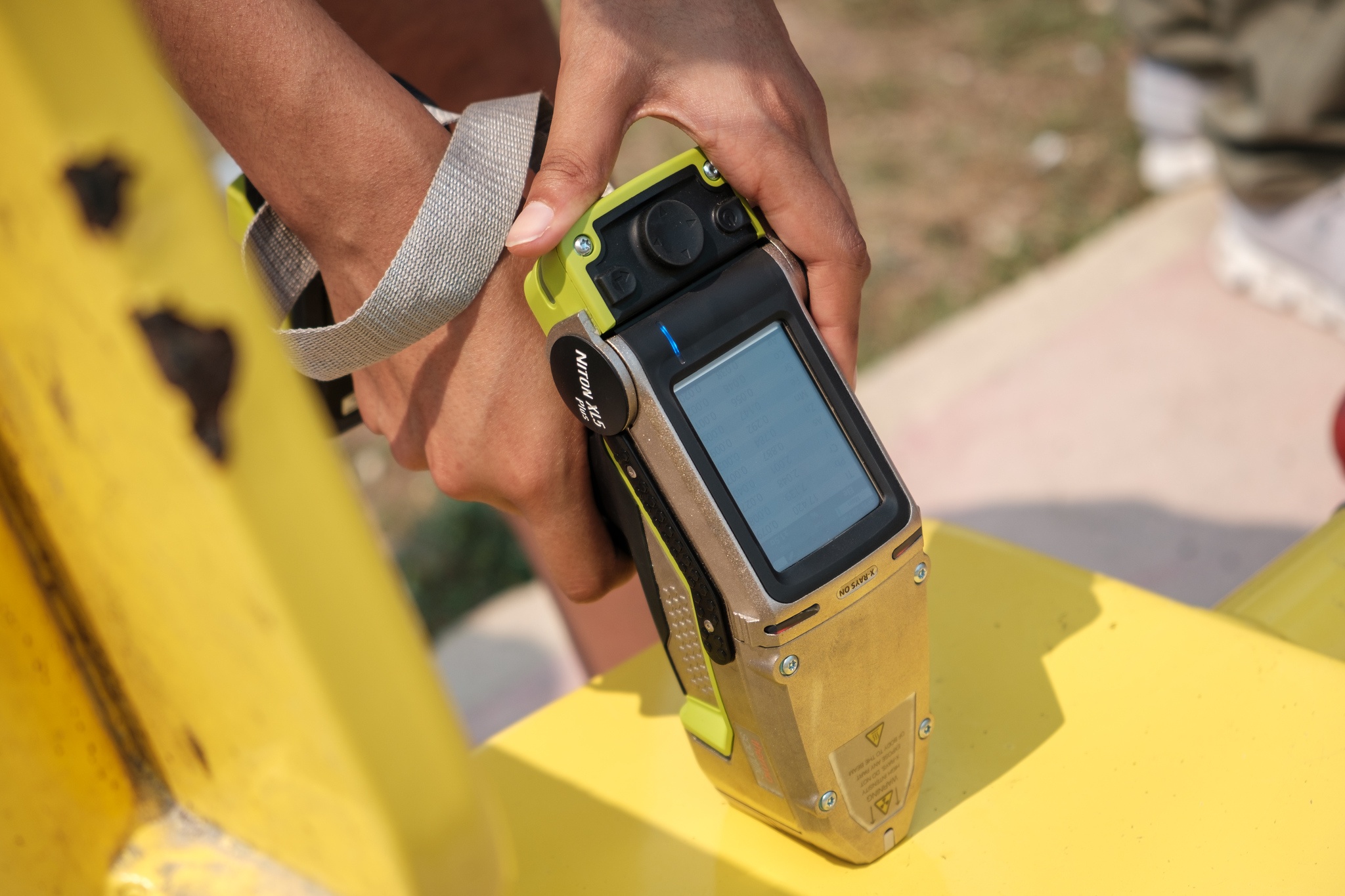 A team from Mercer University tests playground equipment in Belize for the presence of leaded paint.